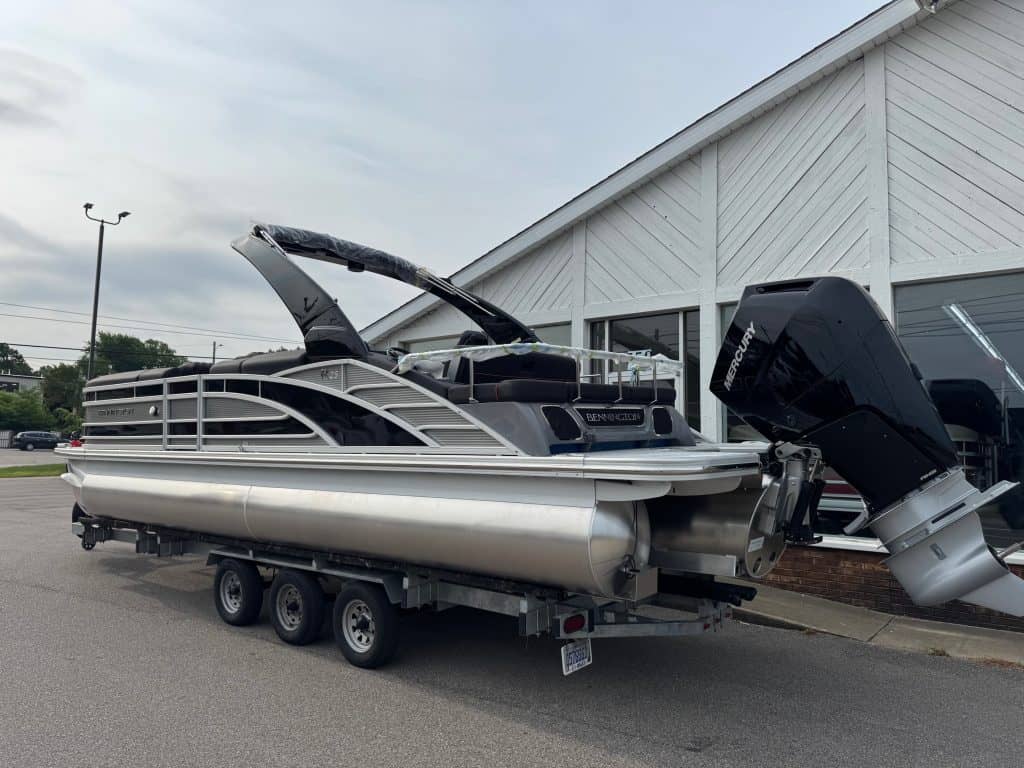 Bennington 25 RSBA pontoon boat displayed at Hall's Sport Center, perfect for family fun and water a.
