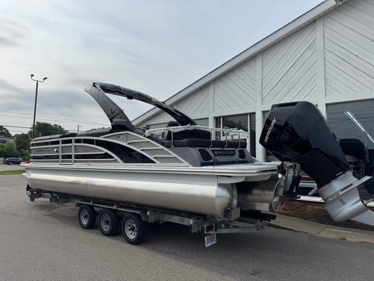 Bennington 25 RSBA pontoon boat displayed at Hall's Sport Center, perfect for family fun and water a.