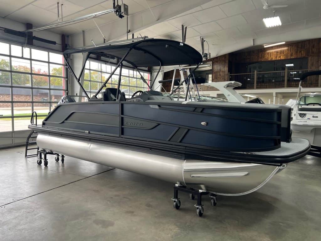 Luxury pontoon boat with sleek black and white design.