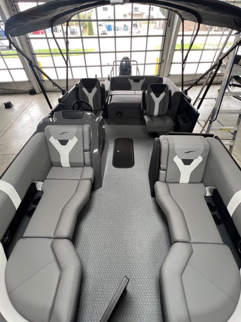Modern luxury pontoon boat with spacious seating and advanced features.