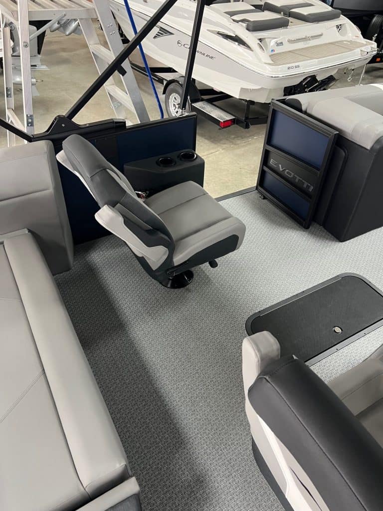 Luxury pontoon boat helm station with advanced controls.