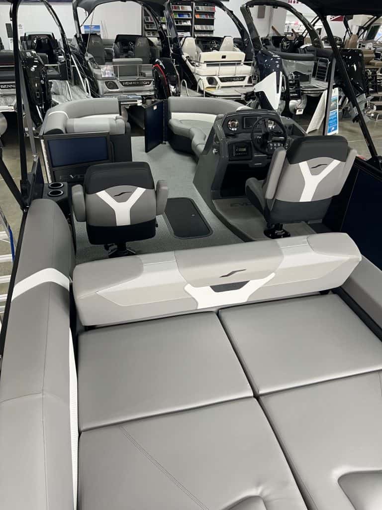 Luxury pontoon boat with spacious seating and modern controls.