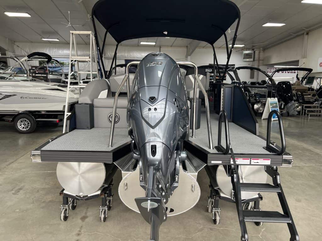 High-performance 2026 EVOTTI 521CS pontoon boat with powerful outboard motor.