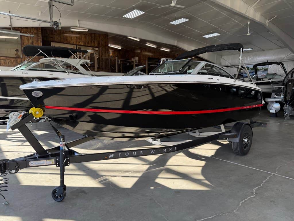 Modern Four Winns H1 Freedom boat displayed at Hall's Sport Center showroom.