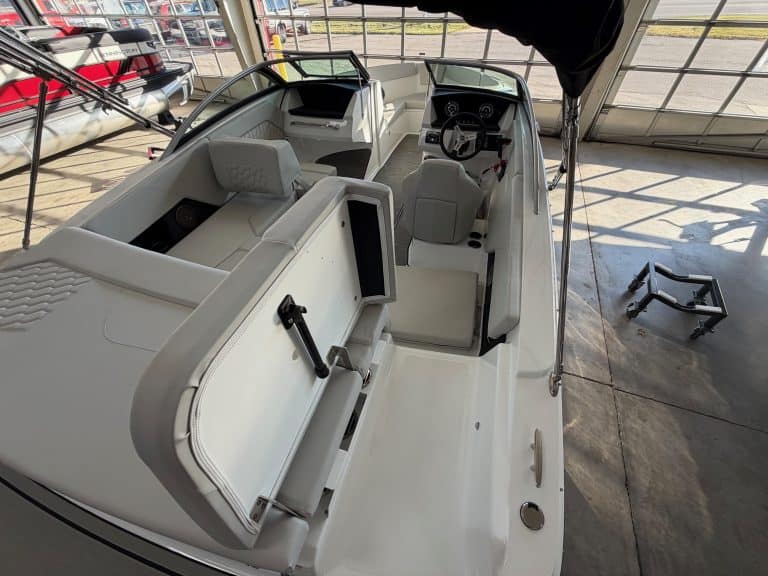 Four Winns H1 Freedom boat interior with modern seating and steering console.