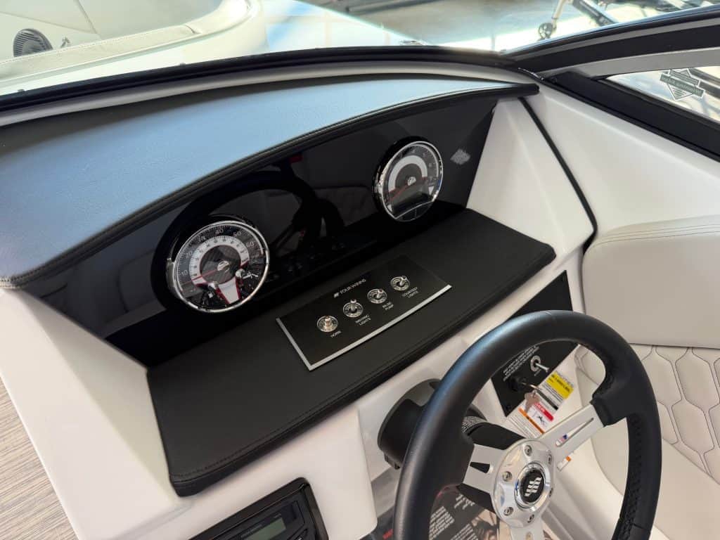 Interior dashboard of the 2026 Four Winns H1 Freedom boat at Hall's Sport Center.