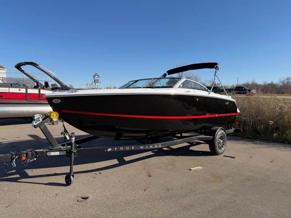 Four Winns H1 Freedom boat on trailer at Hall's Sport Center.