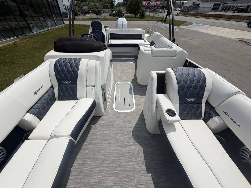 Premium white pontoon boat with black accents at Hall's Sport Center.