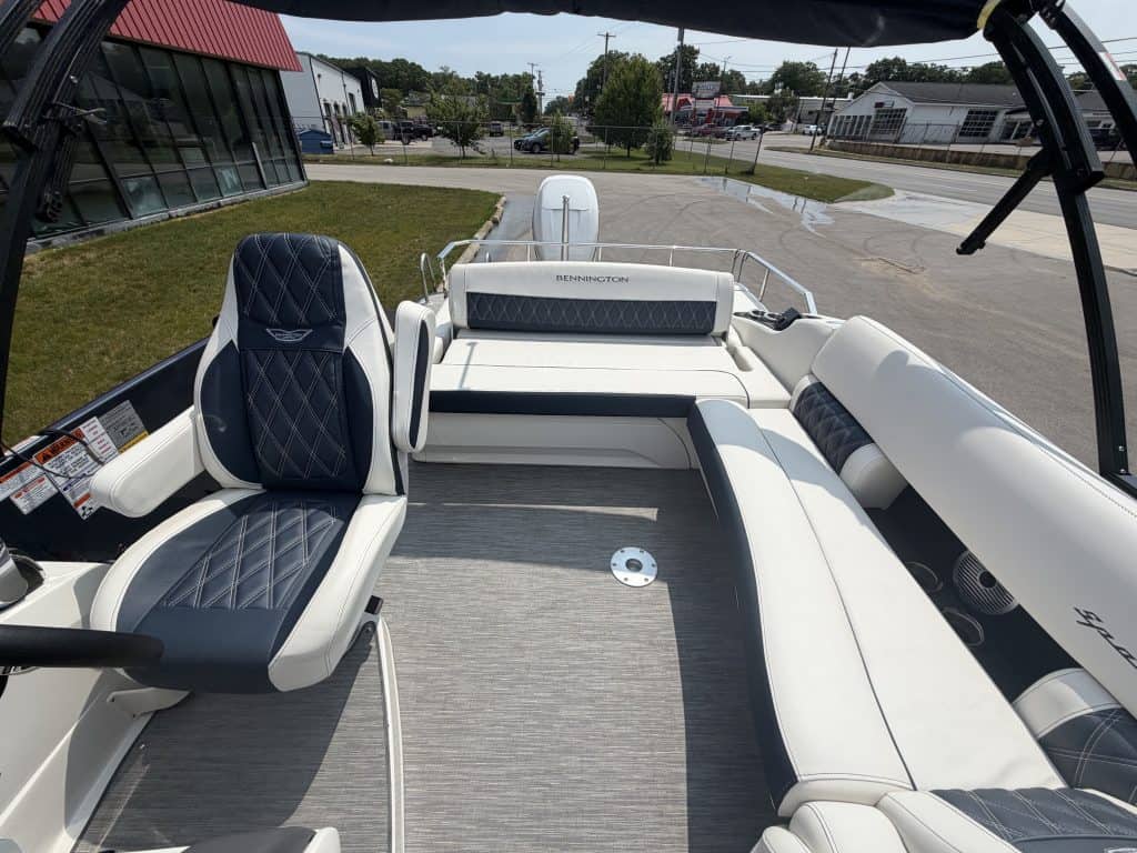 Modern boat interior with comfortable seating and steering wheel at Hall's Sport Center.