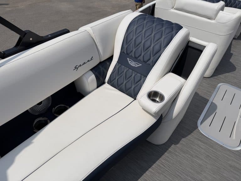 Luxury boat lounge seat with premium upholstery and built-in cup holder.