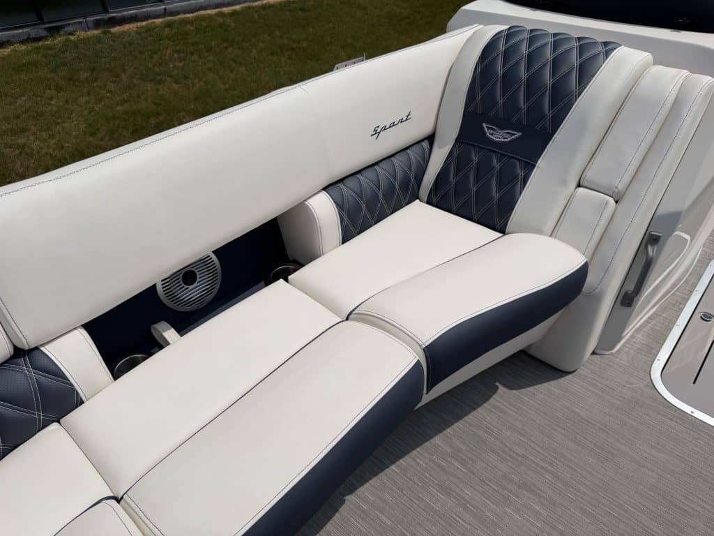Luxury boat seating with white and navy upholstery at Hall's Sport Center.