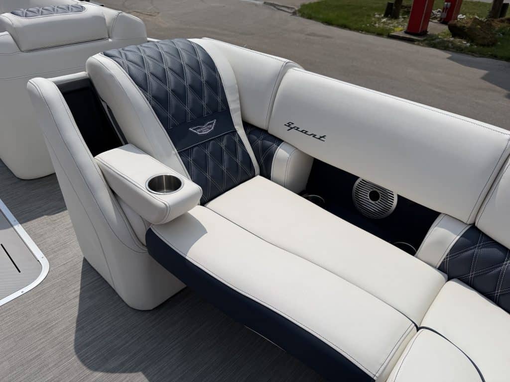 Luxury boat lounge seating with built-in cup holder and premium upholstery.