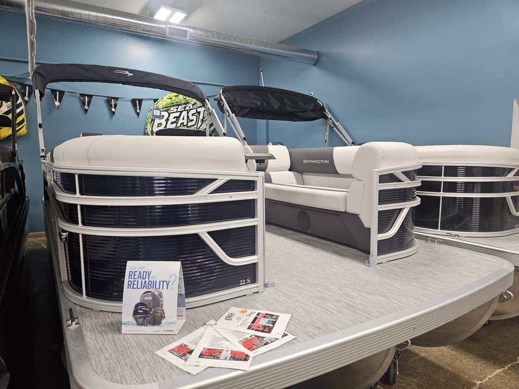 Bennington 22 SSR pontoon boat displayed indoors at Hall's Sport Center.