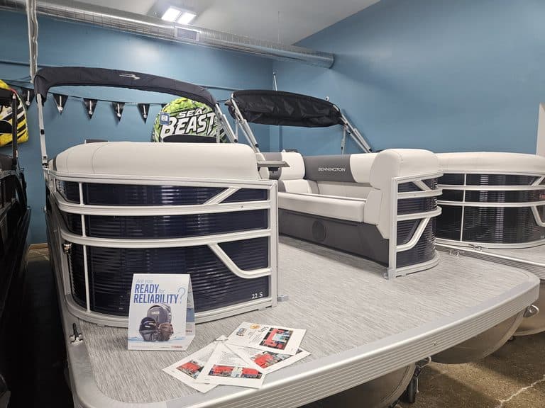 Bennington 22 SSR pontoon boat displayed indoors at Hall's Sport Center.