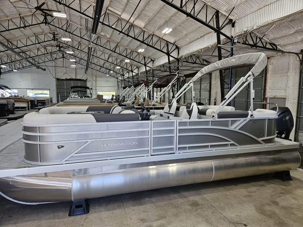 Bennington 22 SSR pontoon boat inside Hall's Sport Center.