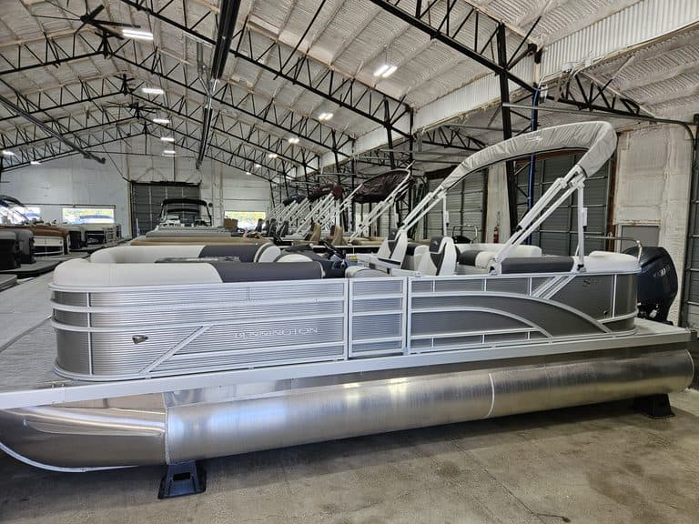 Bennington 22 SSR pontoon boat inside Hall's Sport Center.