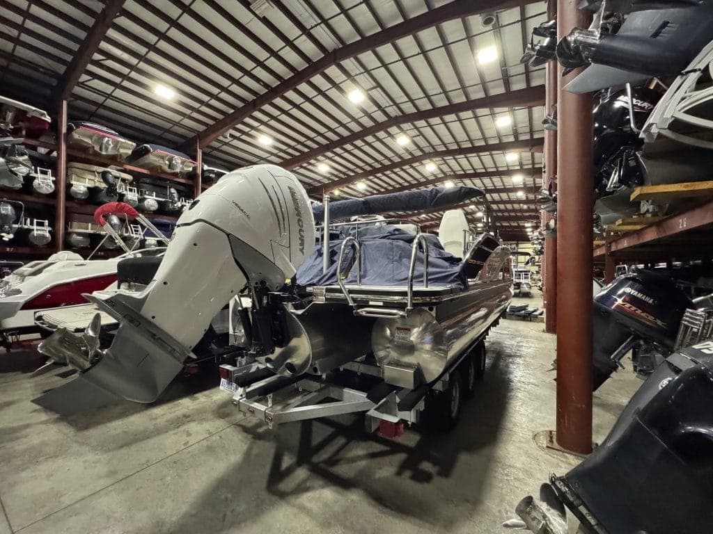 Bennington 23 RXSB pontoon boat with outboard motor at Hall's Sport Center. Perfect for water advent.