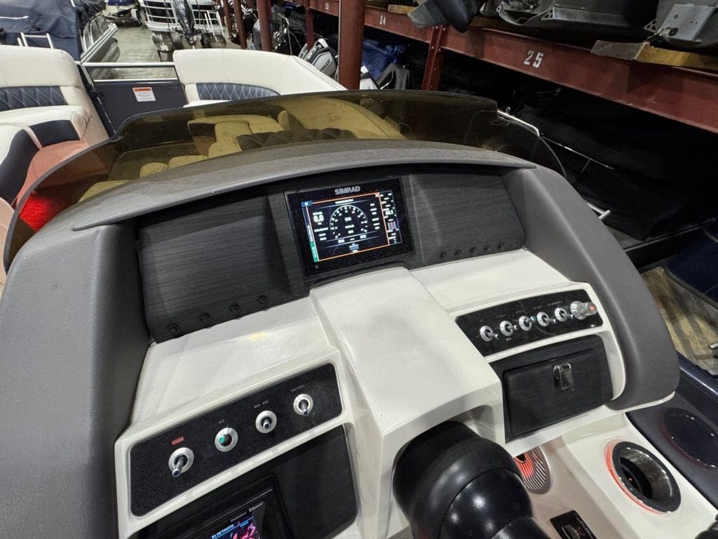 Bennington 23 RXSB boat dashboard with digital controls and navigation display.