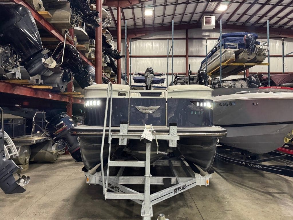 Bennington 23 RXSB luxury pontoon boat in showroom.