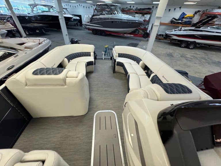 View of the Bennington 23 RXSB pontoon boat inside Hall's Sport Center showroom.