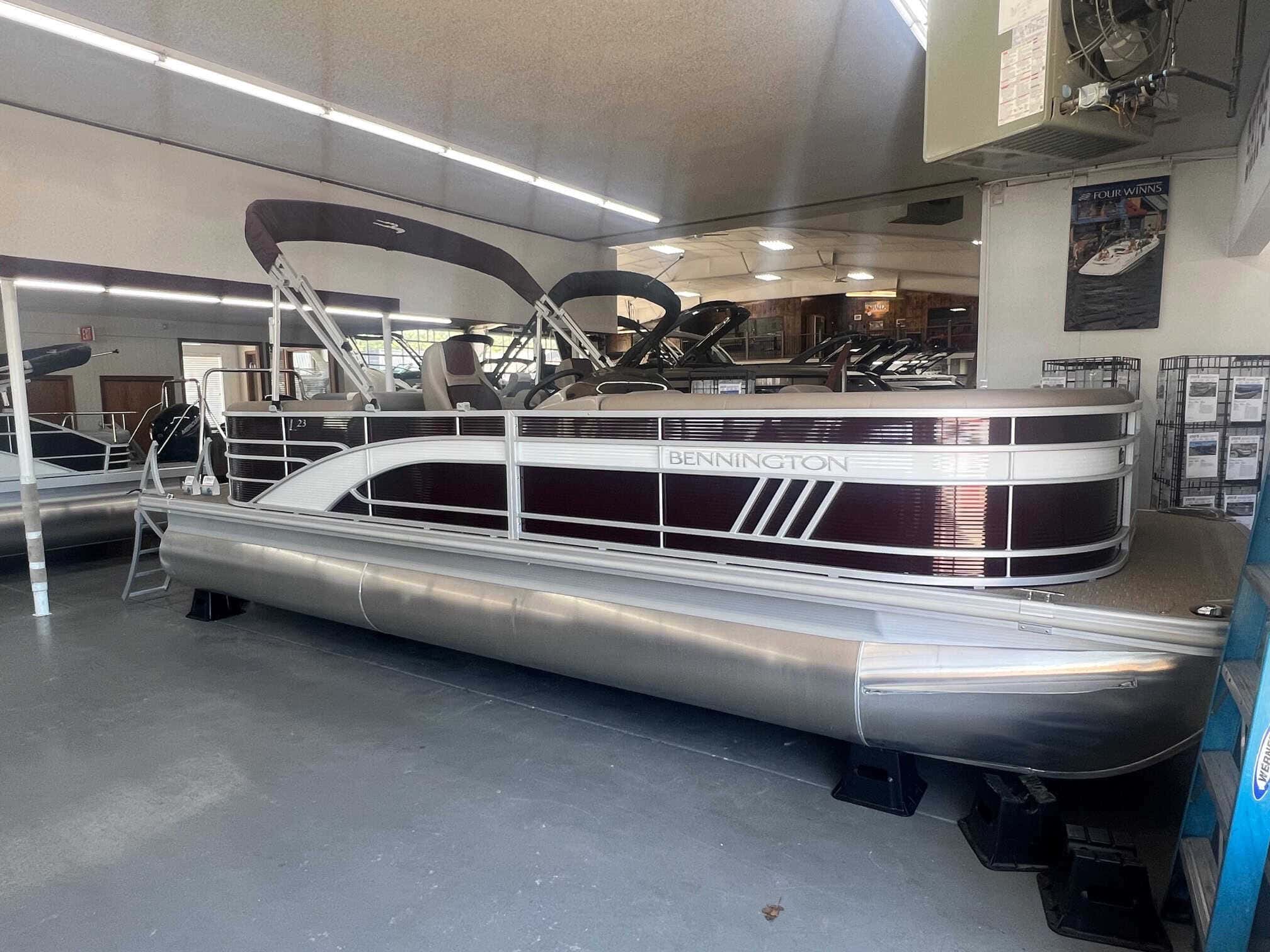 Bennington 23 LSR pontoon boat displayed at Hall's Sport Center.