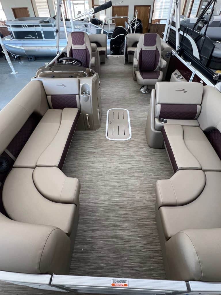Spacious interior of the 2023 Bennington 23 LSR pontoon boat at Hall's Sport Center.