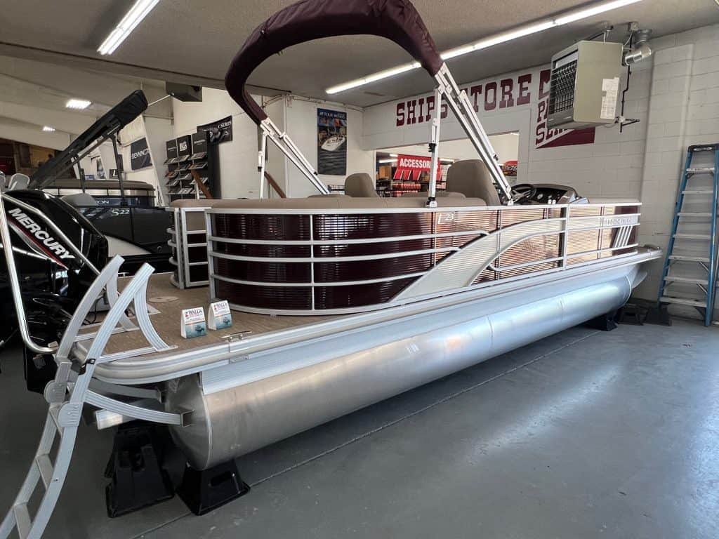New Bennington 23 LSR pontoon boat displayed at Hall's Sport Center showroom.