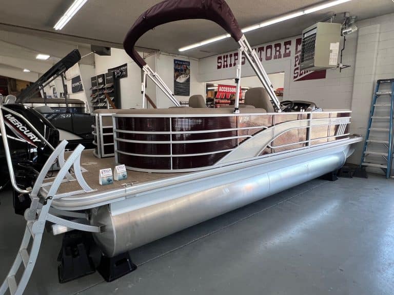 New Bennington 23 LSR pontoon boat displayed at Hall's Sport Center showroom.