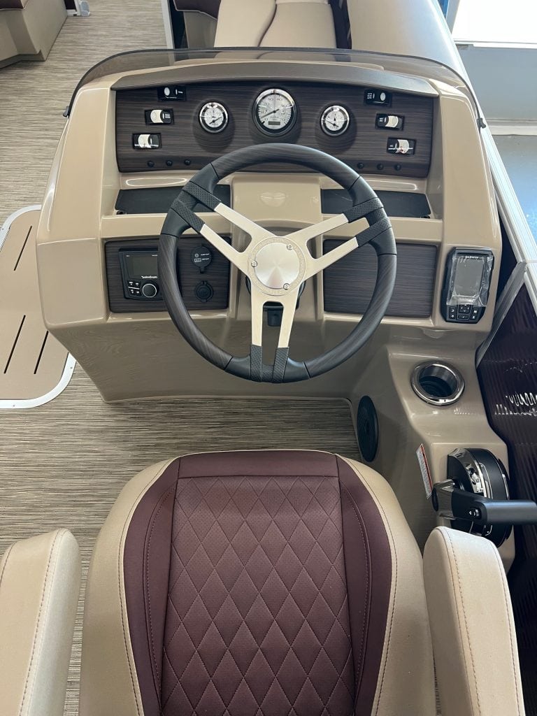 Helm and dashboard of the 2023 Bennington 23 LSR boat at Hall's Sport Center.