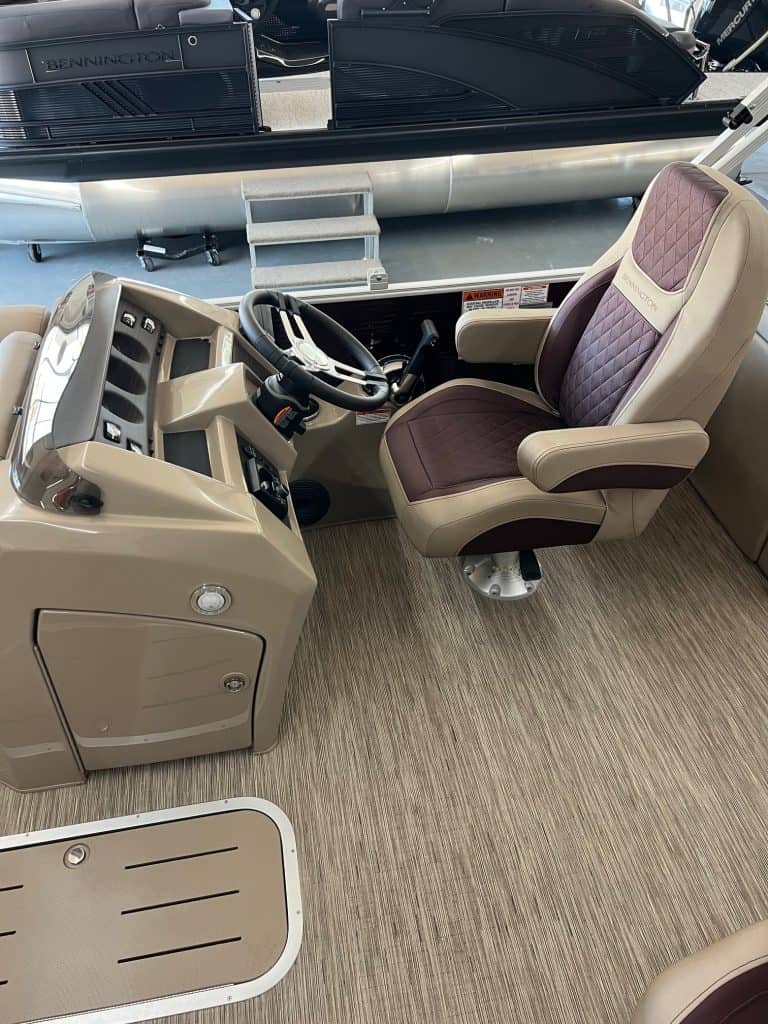Helm seat in a Bennington 23 LSR pontoon boat, featuring comfortable upholstery and ergonomic design.
