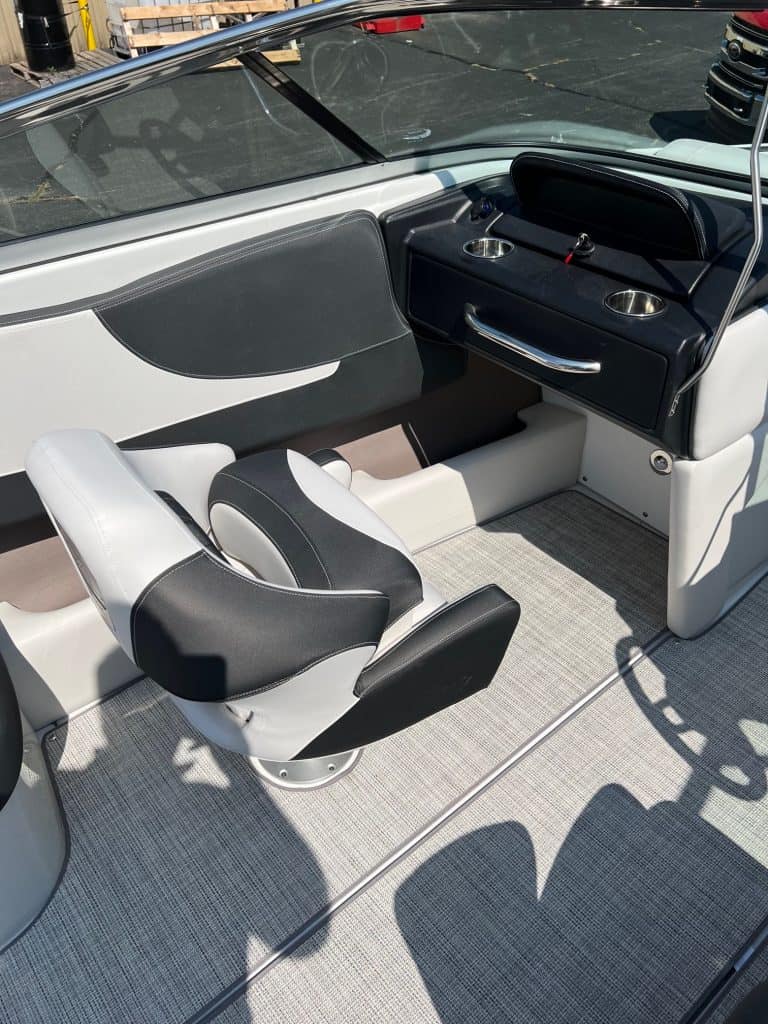 Elegant Crownline 240 SS boat cockpit with comfortable seating and modern controls. Perfect for fami.