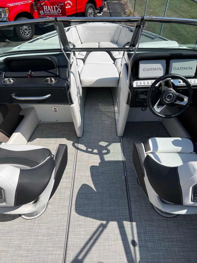 Elegant interior of the 2024 Crownline 240 SS boat with modern dashboard and comfortable seating.