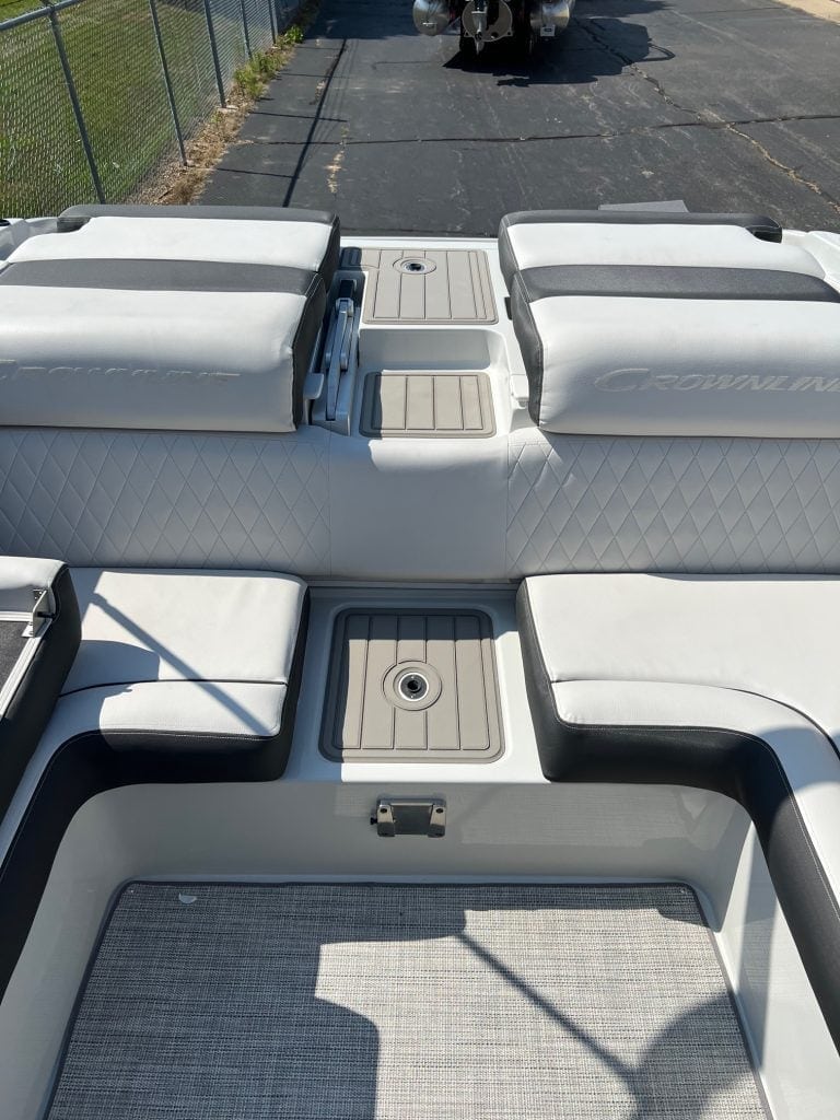 View of the interior seating and deck area of a 2024 Crownline 240 SS boat.