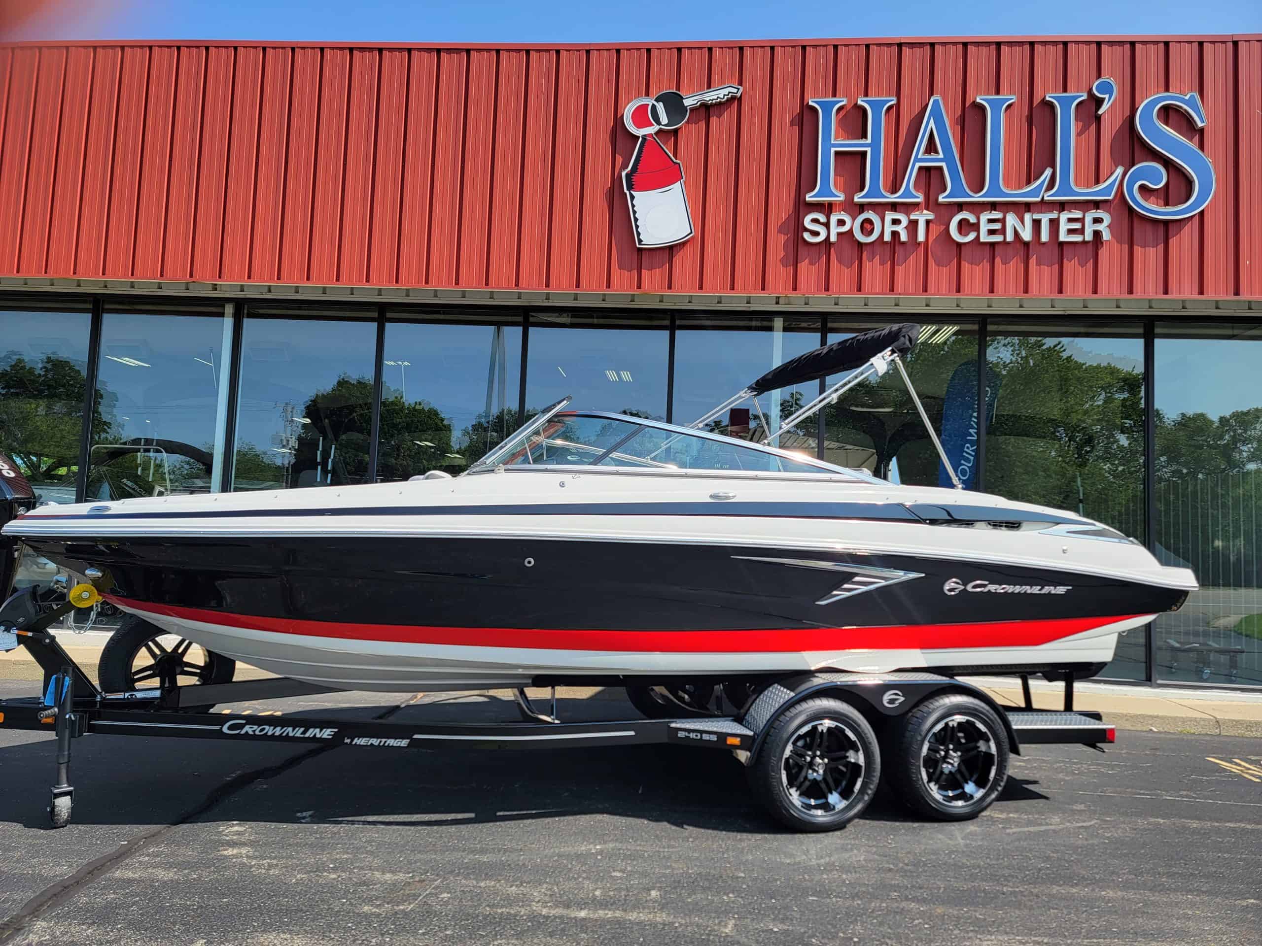 Luxury Crownline 240 SS boat displayed outside Hall's Sport Center for 2024 model showcase.