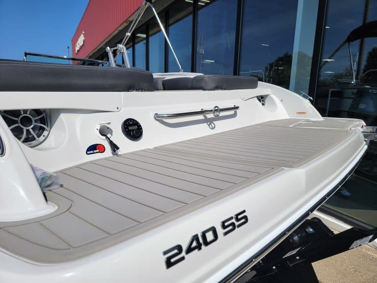 White Crownline 240 SS boat with spacious deck and sleek design.