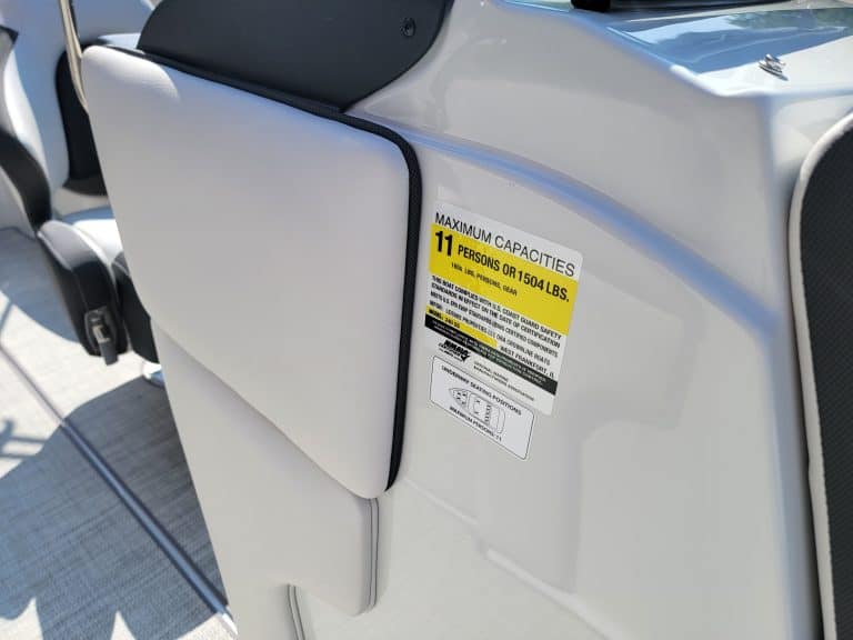 Close-up of maximum capacity label on Crownline 240 SS boat seat.