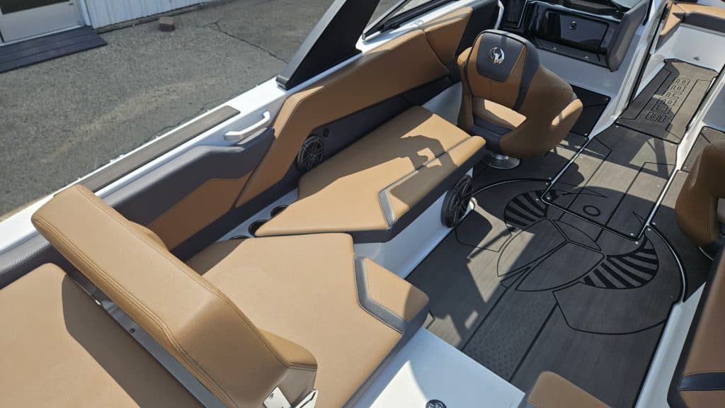 Modern Scarab 235 ID boat with tan seating at Hall's Sport Center.