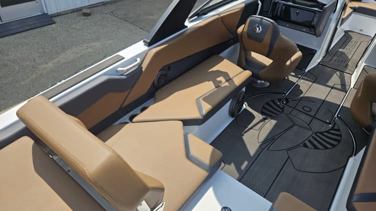 Modern Scarab 235 ID boat with tan seating at Hall's Sport Center.