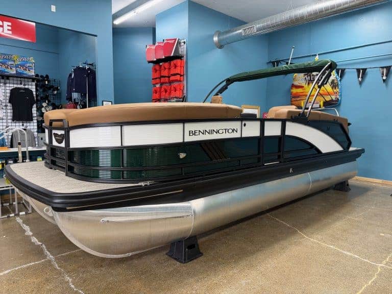 Bennington 22 MFB pontoon boat for sale at Hall's Sport Center. Perfect for family outings and water.
