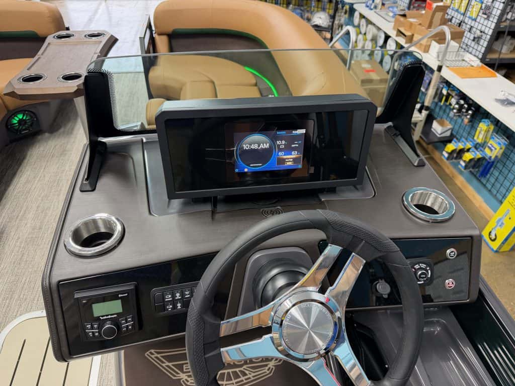 Bennington 22 MFB boat dashboard with touchscreen display and steering wheel.