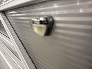 Close-up of a boat trailer lock on a silver boat hull at Hall's Sport Center.
