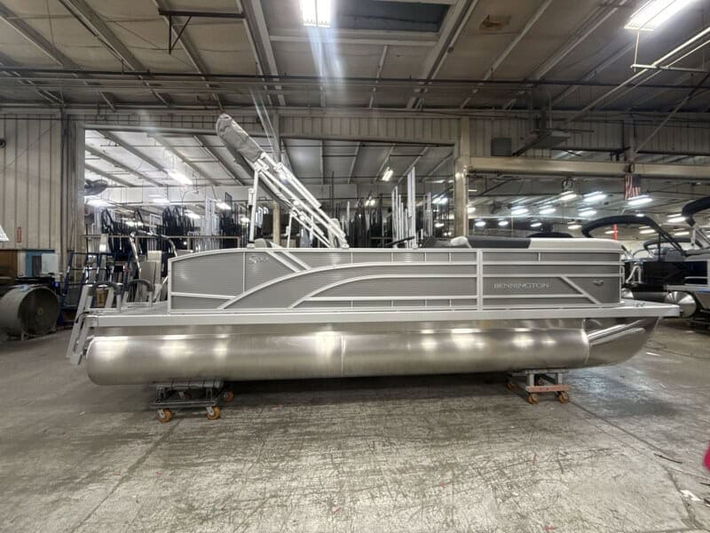 Bennington 22 S1-SSB pontoon boat displayed at Hall's Sport Center, ideal for boating enthusiasts.