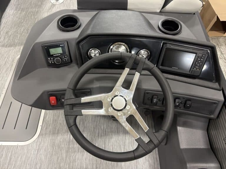 Dashboard of a 2026 Bennington 22 S1SB boat with steering wheel and control panels.