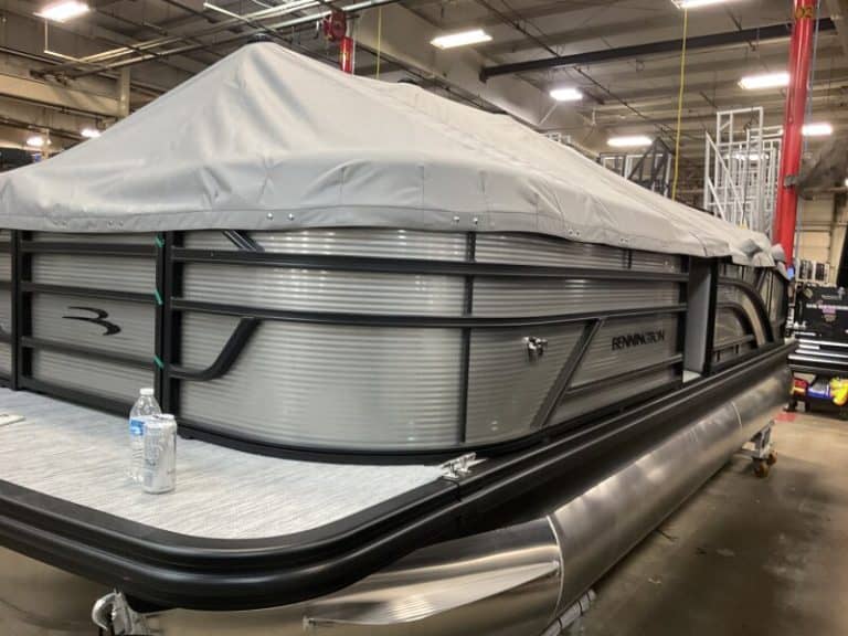 Bennington 22 S1SB pontoon boat displayed at Hall's Sport Center, ideal for fishing and leisure.