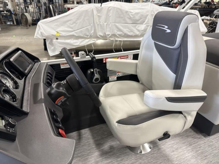 Comfortable captain's seat for Bennington 22 SSR boat at Hall's Sport Center.
