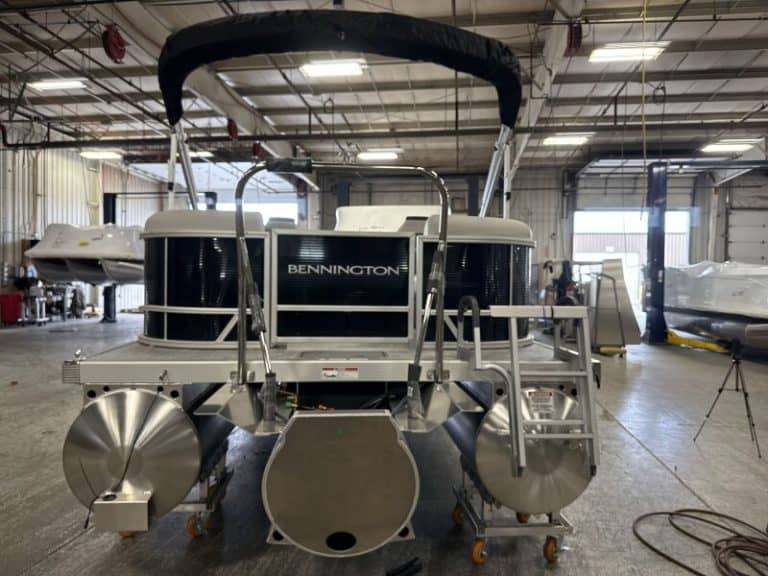 Bennington 22 SSR pontoon boat in showroom, ready for sale.