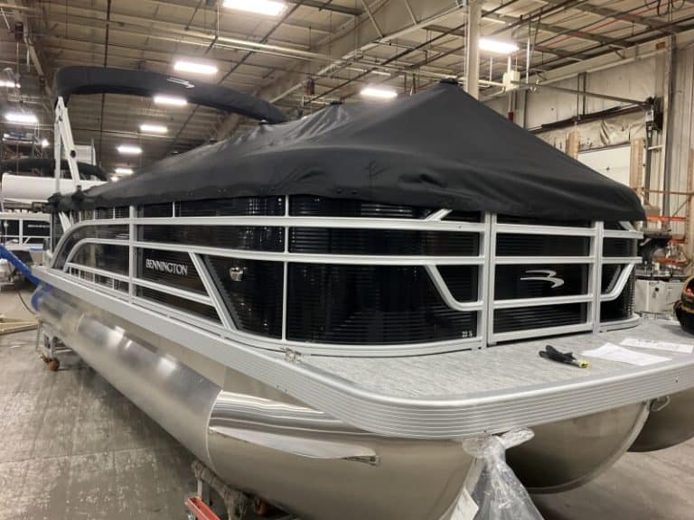 Bennington 22 SSR pontoon boat with cover at Hall's Sport Center.