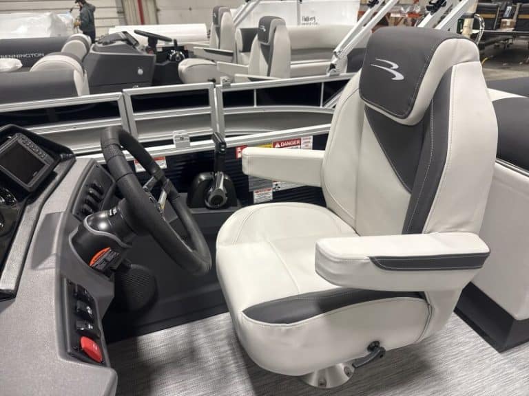 Close-up of the Bennington 22 SSR boat helm and seating at Hall's Sport Center.