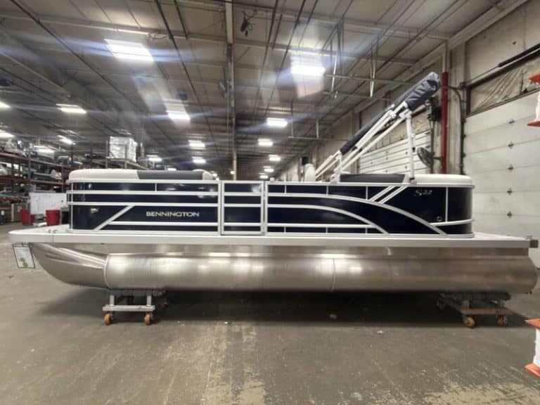 Bennington 22 SSR pontoon boat inside Hall's Sport Center showroom.