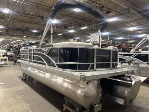 Bennington 22 SSR pontoon boat displayed at Hall's Sport Center, perfect for family fun and water ad.